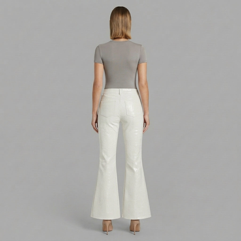 Back view of white genuine leather flares opening from the knee