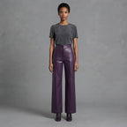 Front view of women's purple wide leg leather pants with charcoal tee and black boots