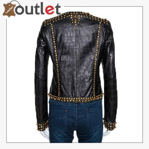 Close view of set metal studs on embossed black leather jacket